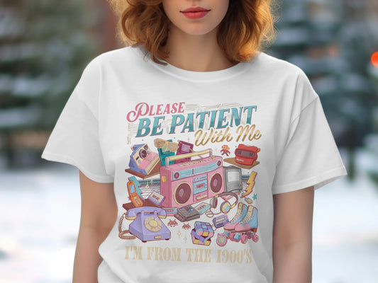 White t-shirt with retro 90s items and text "PLEASE BE PATIENT With Me", "I'M FROM THE 1900'S".